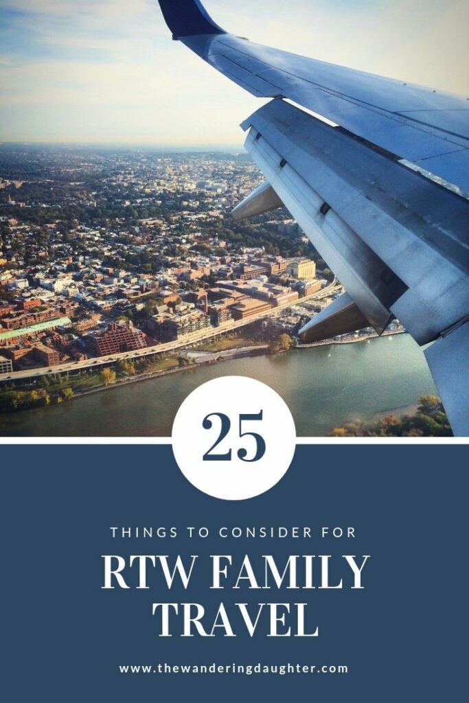 Pinterest Image for blog post: 25 Things To Consider For RTW Family Travel. An image of the wing of a plane, overlooking a city and a river.