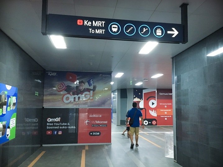 A man walking through an MRT station in Jakarta, Indonesia, visiting attractions in Jakarta