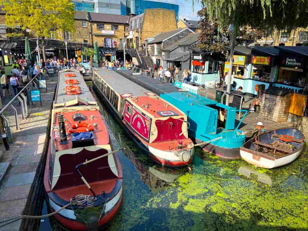 Canal boats waiting in the water in Camden Market during an England itinerary for families visiting England with kids