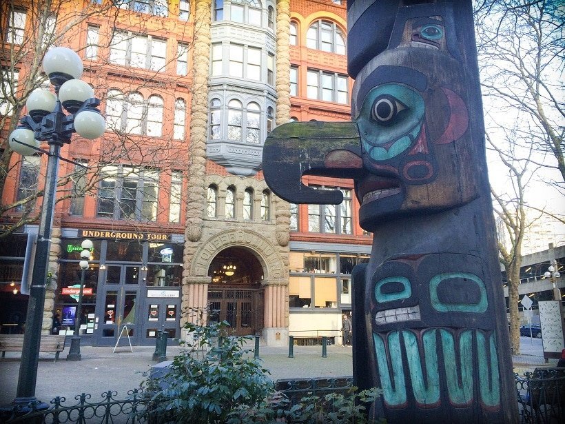 A totem pole in downtown Seattle, WA, U.S.A. in front of the entrance to  the Underground Tour, one of the activities in Seattle for families