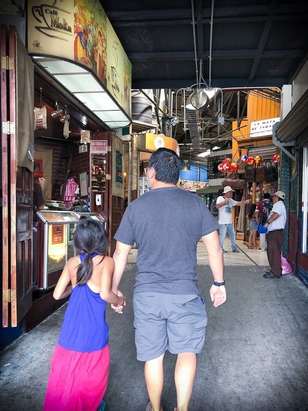 Walking through a market in San Jose while visiting Costa Rica with kids