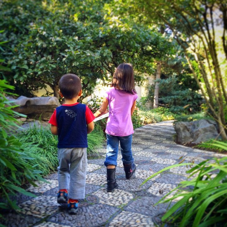 Kids exploring a garden in kid friendly Portland