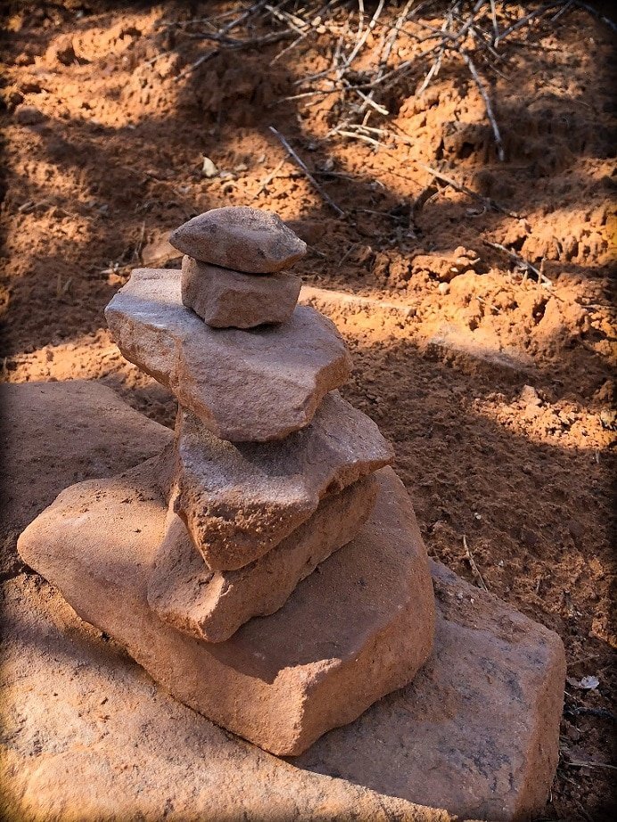 Stone stacks in the shade, seen on a hike at Arches National Park with kids