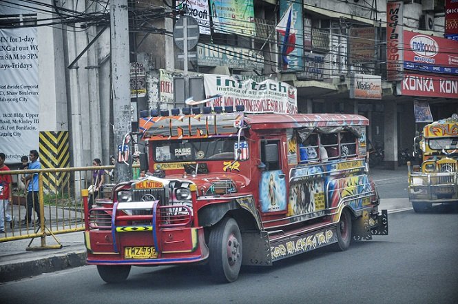 A jeepney on the street in Manila, transportation for one day in Manila