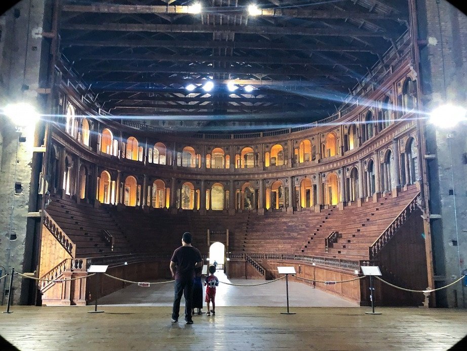 A man and boy visiting Teatro Farnese in Parma, Italy, an example of what to do in Parma