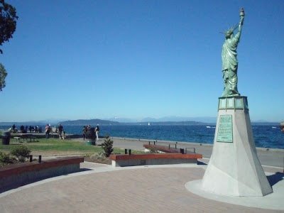 Statue of Liberty replica overlooking Alki Beach in Seattle, where there are  many water activities in Seattle for families to do
