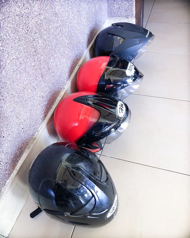 Black and red scooter helmets for use during a scooter rental in Bali and Lombok