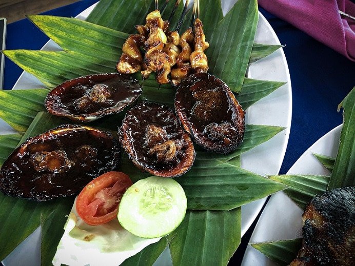 Traditional Sasak dish of clams. Trying out local dish a one of the popular things to do in Lombok.