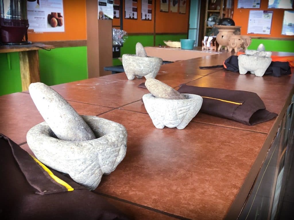 Mortars and pestles on a counter, in preparation for a chocolate workshop from ChocoMuseo La Fortuna in La Fortuna, Costa Rica