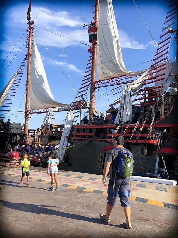 A family walking onto a Puerto Vallarta pirate ship