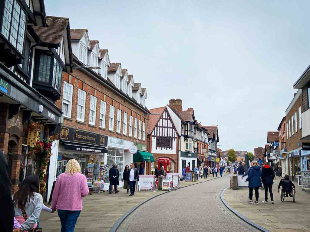 People walking along a street in Stratford-Upon-Avon, one of the places to visit in the West Midlands, UK