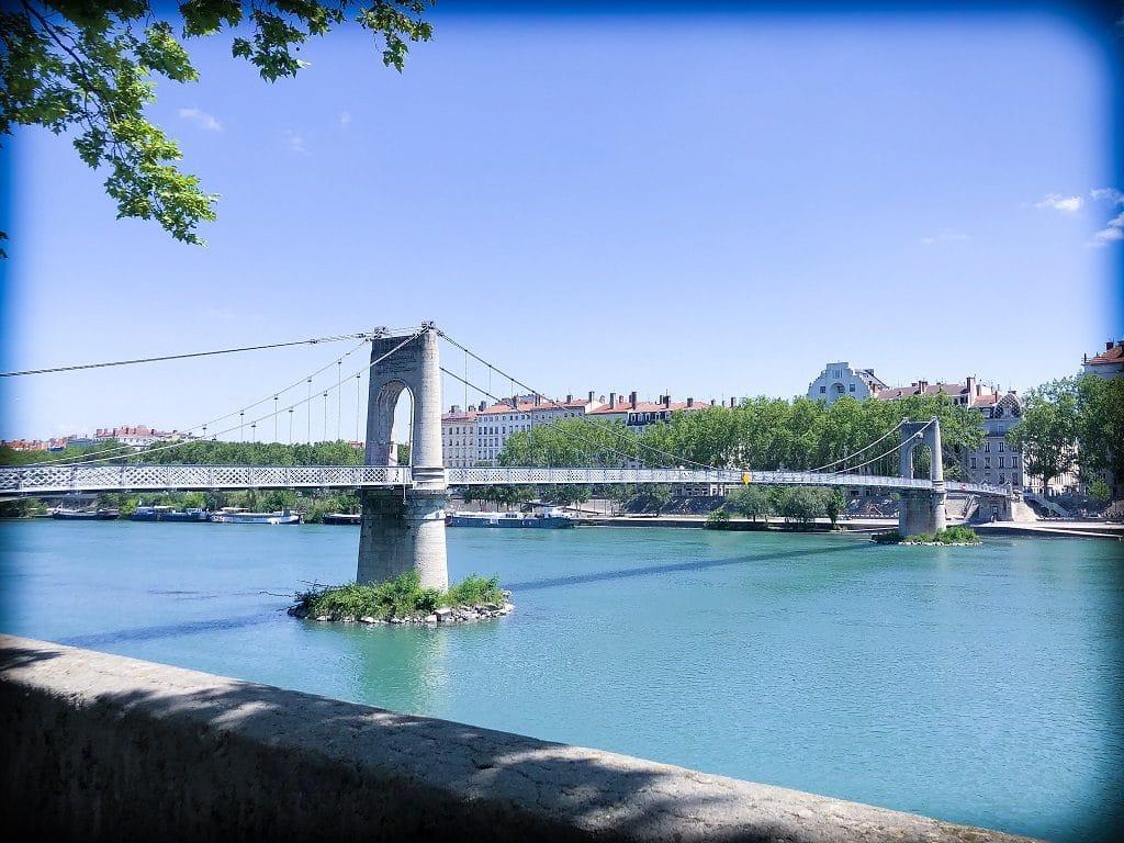 A stone pedestrian bridge in Lyon, France, traversing one of the rivers in Lyon.