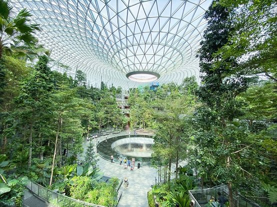 The indoor garden known as the Shiseido Forest Valley at Jewel in Changi Airport, with the Rain Vortex indoor waterfall in the center, one of the things to do in Singapore on a budget
